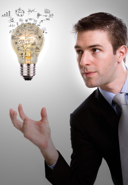 Business man holding light bulb with business concept inside